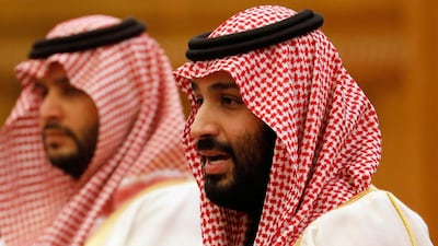 Saudi Crown Prince Mohammad Bin Salman speaks to President Xi Jinping at the Great Hall of the People. EPA