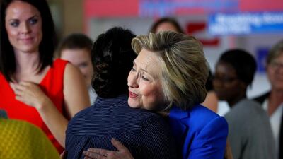 Democratic presidential candidate Hillary Clinton hugs a woman at campaign event for young parents. John Sommers II / Reuters / May 10, 2016
