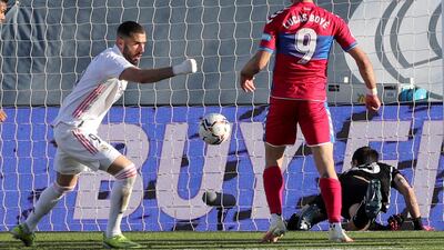 Real Madrid's striker Karim Benzema celebrates after scoring the equaliser against Elche at the Alfredo Di Stefano stadium. EPA