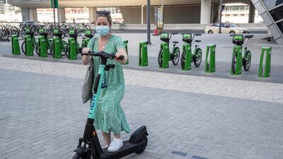 British resident April Kearns says she will make use of the new electric scooters to commute to her office in Jumeirah Lakes Towers. Antonie Robertson / The National