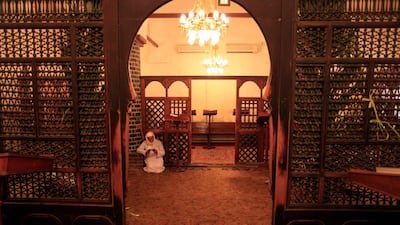A clergyman prays during an early morning mass at the historic Al Muharraq Monastery, in the province of Assiut, Egypt. AP
