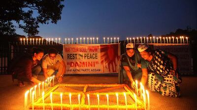 People light candles in Gauhati, India after a judge pronounced death sentences for four men convicted in the rape and murder of a student on a moving bus in New Delhi in 2012. A judge on Friday ordered all four to the gallows for a brutal attack that left the young woman with such severe internal injuries that she died two weeks later. Anupam Nath / AP Photo