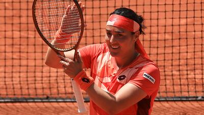 Ons Jabeur celebrates after beating Lucia Bronzetti in the French Open first round on May 30, 2023. AP