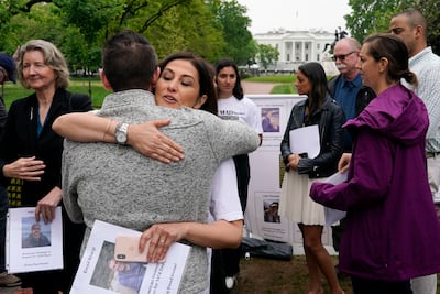 Neda Sharghi hugs former Syrian hostage Sam Goodwin before a news conference with families of Americans currently being held hostage or wrongfully detained overseas in Lafayette Park near the White House in May last year. AP