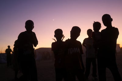 Sudanese refugee children from El Fasher gather at a camp in eastern Chad. Reuters