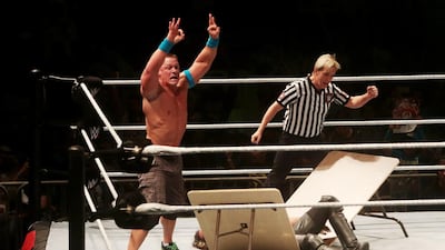John Cena celebrates his defeat of Seth Rollins in their street fight in Abu Dhabi. Christopher Pike / The National