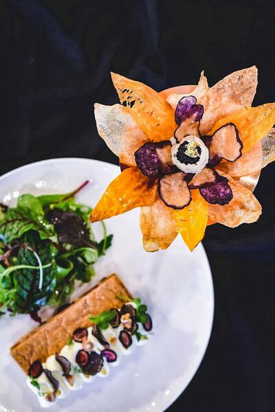 A sharing amuse-bouche of white, yellow, purple and sweet potato, crème fraiche, caviar and chives expertly crafted by the chef into a lotus flower. Courtesy of Masterchef