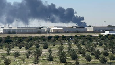 Smoke rises from an area of Kuwait's international airport. AFP