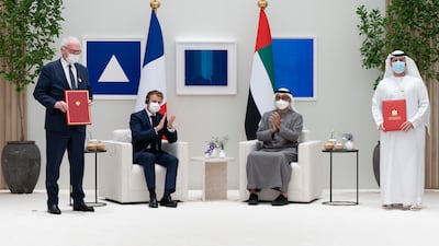 Sheikh Mohamed and Mr Macron with Mohammed Al Hammadi, chief executive of Emirates Nuclear Energy Company, right, and Bruno Le Maire, Minister of the Economy, Finance and Recovery of France. Photo: Ministry of Presidential Affairs