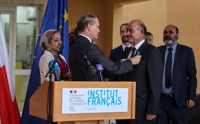 Raji Sourani is given France's National Order of Merit at Institut Francais in Gaza city in July 2021. AFP