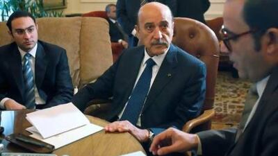 Omar Suleiman talks to representatives from political parties in the prime minister's office in Cairo on February 6, 2011. Asmaa Waguih / Reuters