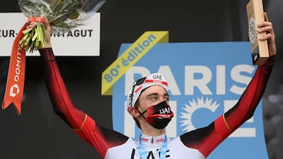 Brandon McNulty celebrates on the podium after winning the fifth stage of the Paris-Nice race. AFP