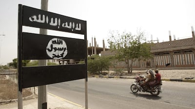 An Al Qaeda logo on a street sign in the town of Jaar in Yemen’s southern Abyan province in 2012. Hani Mohammed / AP
