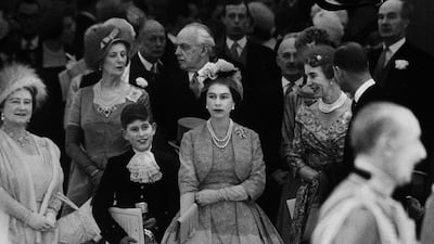 Queen Elizabeth and the Queen Mother with a young Prince Charles at Princess Margaret's wedding at Westminster Abbey in 1960. Getty Images