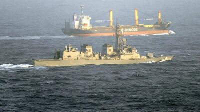 A vessel of the Japan Maritime Self-Defense Force guards a Japanese cargo ship in the Gulf of Aden off the coast of Somalia against piracy. Kyodo