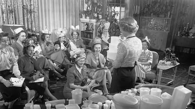 Circa 1950: A Tupperware party underway in someone’s living room. Hulton Archive / Getty Images