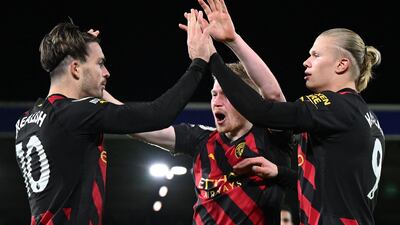 Erling Haaland celebrates scoring City's second goal with Kevin De Bruyne and Jack Grealish. AFP