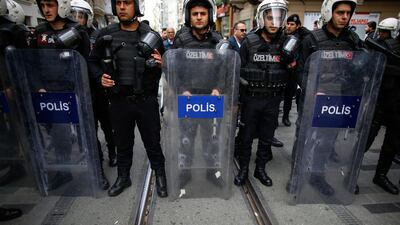 Turkey's police officers look on as supporters of Turkey's main opposition Republican People's Party, CHP, gather to protest near central Istanbul's Taksim Square on April 16, 2018. AP