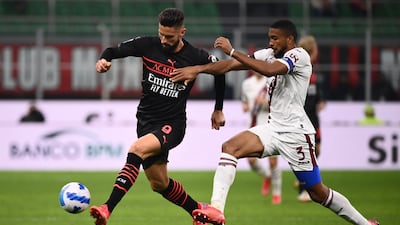 AC Milan's French forward Olivier Giroud fights for the ball with Torino's Brazilian defender Bremer. AFP