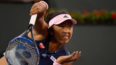 Naomi Osaka serves to Kristina Mladenovic. AP Photo