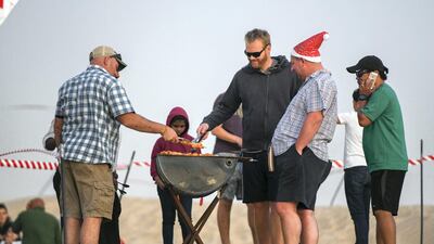 Abu Dhabi, United Arab Emirates - Families use the barbecues provided to cook the food items they brought. Khushnum Bhandari for The National