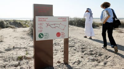 Journalists tour the Al Wathba Wetland Reserve in Abu Dhabi. Christopher Pike / The National