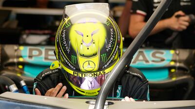 Lewis Hamilton climbs into his car during the second practice session. AP