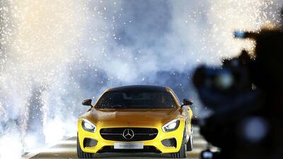 Mercedes Formula One driver Nico Rosberg of Germany drives in the new Mercedes AMG GT on stage during its world premiere. Kai Pfaffenbach / Reuters