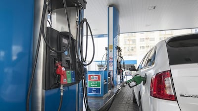 A motorist refuels in Abu Dhabi. Mona Al Marzooqi / The National