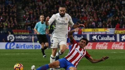 Real Madrid’s Daniel Carvajal in action with Atletico Madrid’s Stefan Savic. Sergio Perez / Reuters