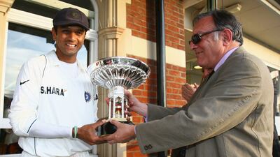 Former India captain Rahul Dravid is presented with the Pataudi trophy by the late Tiger Pataudi in the 2007 Test series in England. Getty Images