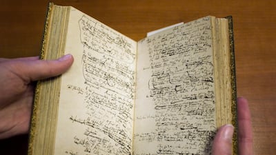 A hand-written original manuscript by Elizabeth Barrett Browning of the epic poem "Aurora Leigh," is held by Mariana Oller, Wellesley College associate curator of special collections at the Margaret Clapp Library. Beginning Valentine's Day Feb. 14, 2012 ???