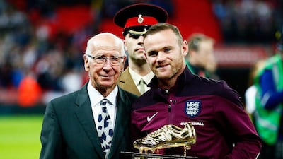 Wayne Rooney of England is presented with the Golden Boot by Bobby Charlton after breaking his record of 49 goals prior to Friday night’s Euro 2016 qualifier against Estonia. Clive Rose / Getty Images