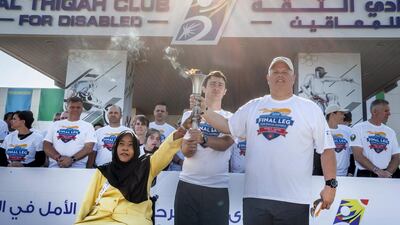 The torch runners met with members of Al Thiqah Club for Handicapped. Leslie Pableo for The National