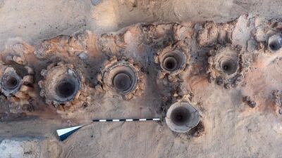 The remains of a row of vats used for beer fermentation, in a complex which may be the world's "oldest" high-production brewery, were uncovered in the Abydos archaeological site near Egypt's southern city of Sohag. Egyptian Ministry of Tourism and Antiquities / AFP