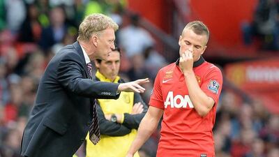 Manchester United manager David Moyes, left, and Tom Cleverley. PA Wire