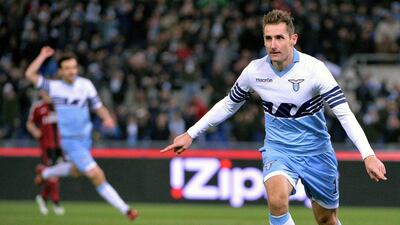 Lazio's Miroslav Klose celebrates after scoring the second, winning goal for his side in a 3-1 Serie A victory over AC Milan on Saturday. Maurizio Brambatti / EPA / January 24, 2015