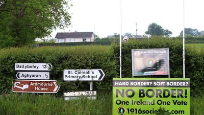 An Anti Brexit sign is seen beside traffic signs on the Corgary Road near Castlederg, Northern Ireland. Northern Ireland could be given joint EU and UK status and a 'buffer zone' on its border with the Republic, under new plans being drawn up by David Davis, according to reports. Paul Mcerlane / EPA