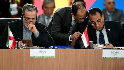 Iran's Foreign Minister Abbas Araghchi, left, and Egypt's Prime Minister Mostafa Madbouly, right, at the Brics summit second plenary session. AFP