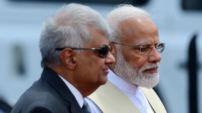 Sri Lankan Prime Minister Ranil Wickremesinghe, left, with Indian Prime Minister Narendra Modi during a welcome ceremony at Bandaranaike International Airport in Katunayake on June 9, 2019. AFP
