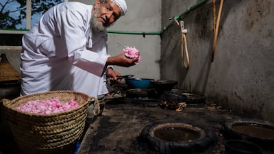 Al-Thani uses a traditional method to extract rosewater from the harvest.