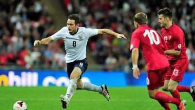 Frank Lampard himself did not expect to last longer than 20 caps for England but he has grown in his role in the midfield even as age is catching up on him. Glyn Kirk / AFP