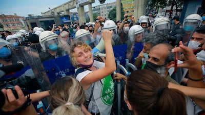 Demonstrators opposing Turkey's President Recep Tayyip Erdogan's Istanbul Canal project chant slogans as they are challenged by Turkish police officers in Istanbul on June 26, 2021. AP Photo