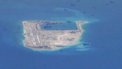 The Chinese military has installed anti-ship and air-to-air defences on outposts such as the Spratly Islands, according to CNBC. US Navy/Handout via Reuters