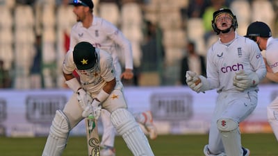 England wicketkeeper Ollie Pope celebrates after the dismissal of Pakistan's Imam-ul-Haq for 60. AP