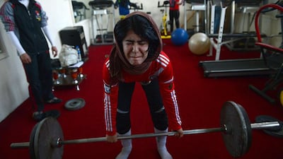 An Afghanistan national powerlifting team members take part in a training session.