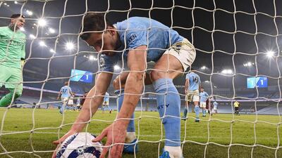 City defender Ruben Dias picks the ball out of the net after Coady's goal. AFP