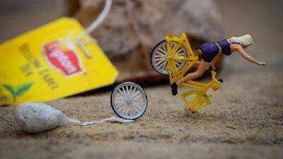 A woman falls off her bike as she trips over some waste left on the ground. This scene has a social message in the caption: “Littering can cause you to fall off your bike, but most importantly it harms our environment. Courtesy Omar Maree Humaid
