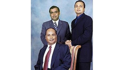 Mukesh Ambani, left, Anil Ambani, pictured with their father Dhirubhai Ambani in November 2000.