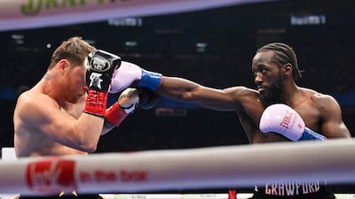Terence Crawford and Canelo Alvarez in action. AP